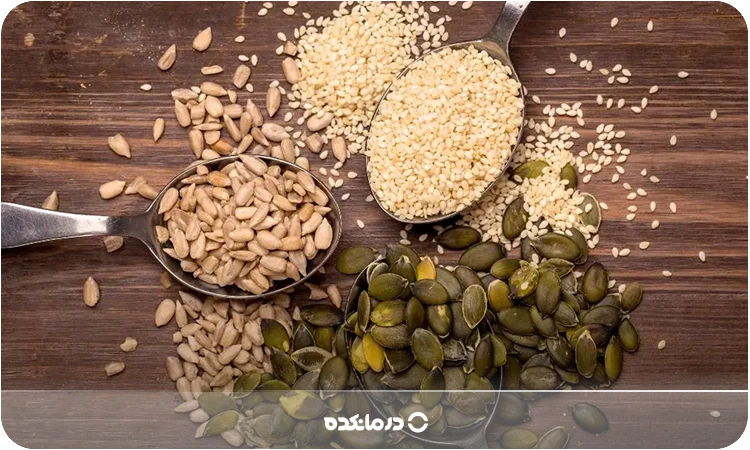 تصویری از تخمه کدو، کنجد و تخمه آفتابگردان کنار هم